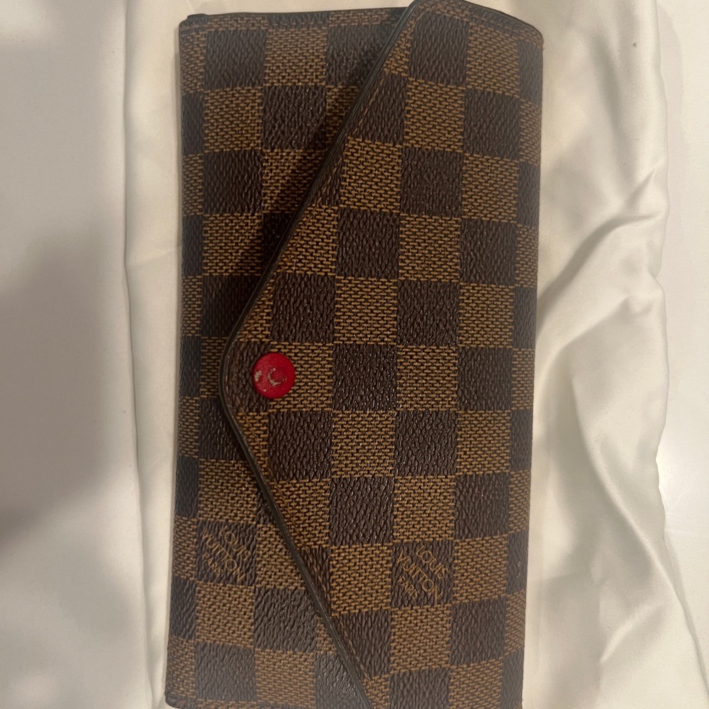 Women’s wallet used with Louis Vuitton box